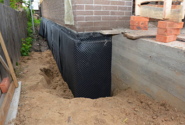 Happy homeowners after waterproofing job in Elora